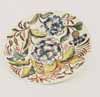 Plate flowers yellow green leaves
